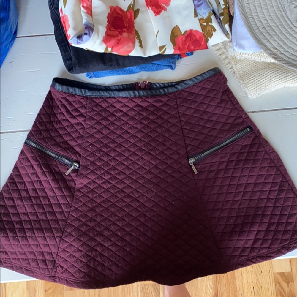 Maroon quilted skirt with leather, zipper accents